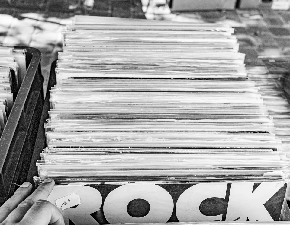 Stack of vinyl records with 'rock' visible